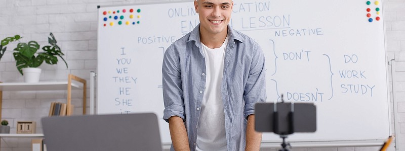 Teacher standing in front of whiteboard